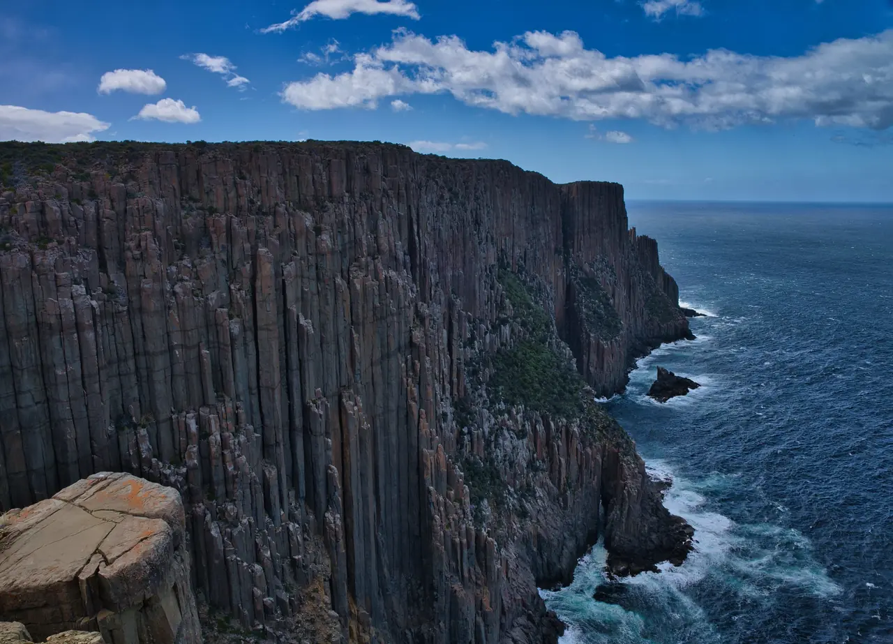 Towering dolerite column cliffs dropping into the sea