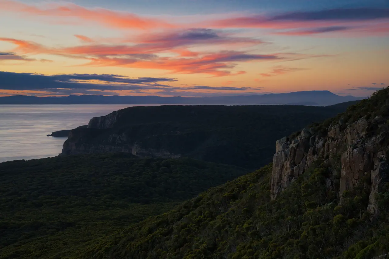 Sea cliffs and headlands at sunset